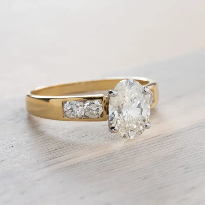 1.22ctw Oval Cut and Round Brilliant Diamond Engagement Ring in 18k Two-Tone Gold