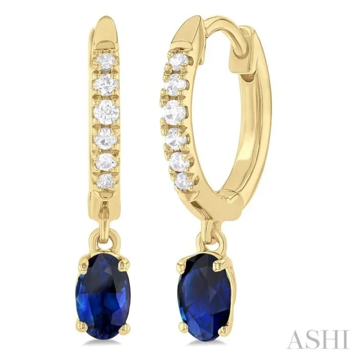 5×3 MM Oval Cut Sapphire and 1/8 Ctw Petite Round Cut Diamond Precious Fashion Huggies in 10K Yellow Gold