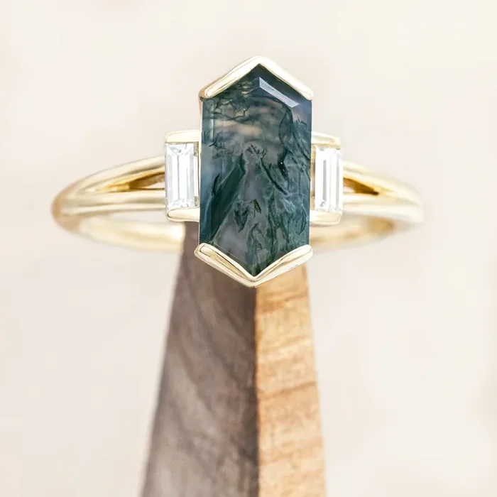 “CORELLA” – HALF BEZEL SET ELONGATED HEXAGON CUT MOSS AGATE ENGAGEMENT RING WITH DIAMOND ACCENTS