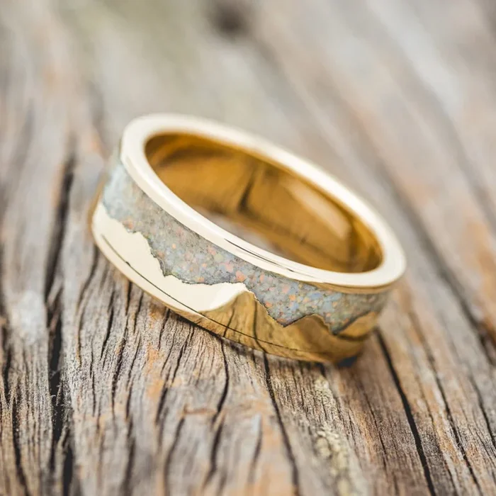 “HELIOS” – FIRE AND ICE OPAL & GOLD MOUNTAIN RANGE WEDDING RING FEATURING A 14K GOLD BAND
