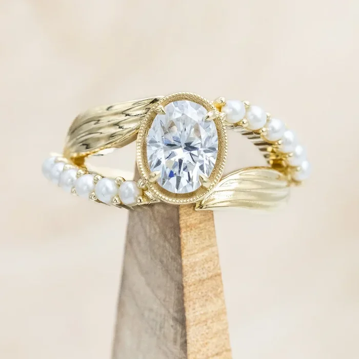 “LILY” – OVAL CUT MOISSANITE ENGAGEMENT RING WITH PEARL ACCENTS