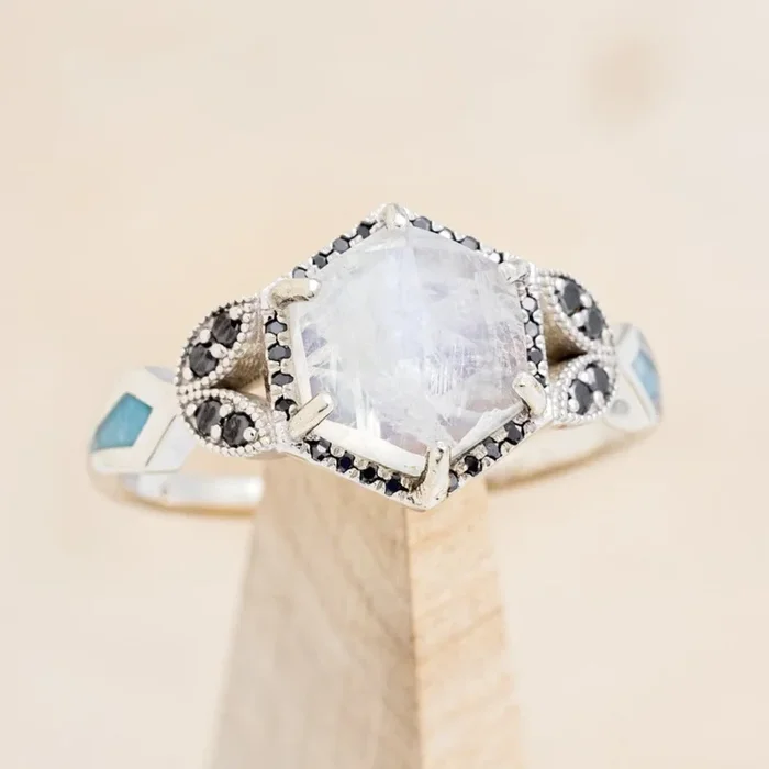 “LUCY IN THE SKY” – FACETED HEXAGON CUT MOONSTONE ENGAGEMENT RING WITH BLACK DIAMOND ACCENTS & TURQUOISE INLAYS