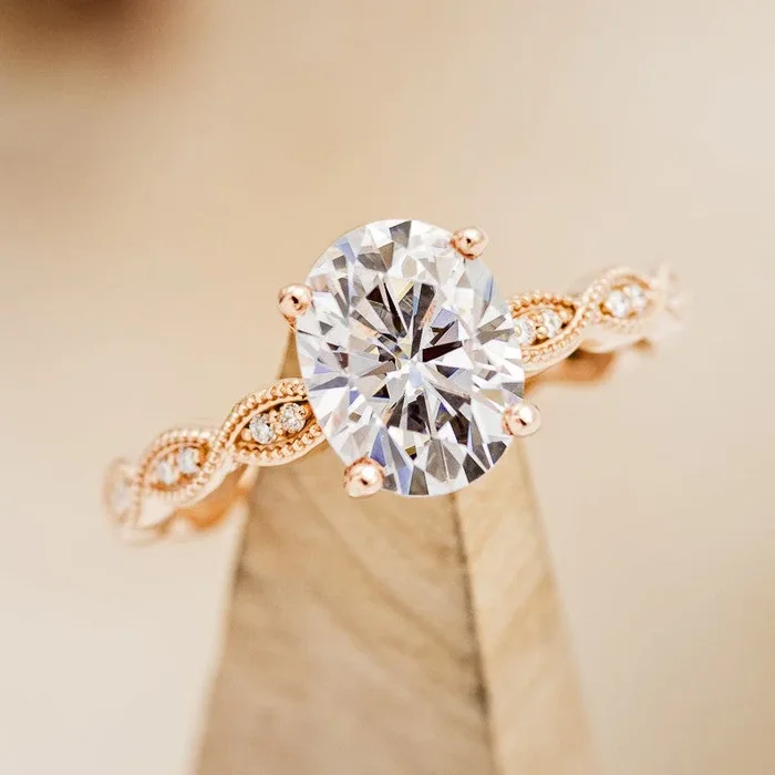 “NAOMI” – OVAL CUT MOISSANITE ENGAGEMENT RING WITH DIAMOND ACCENTS