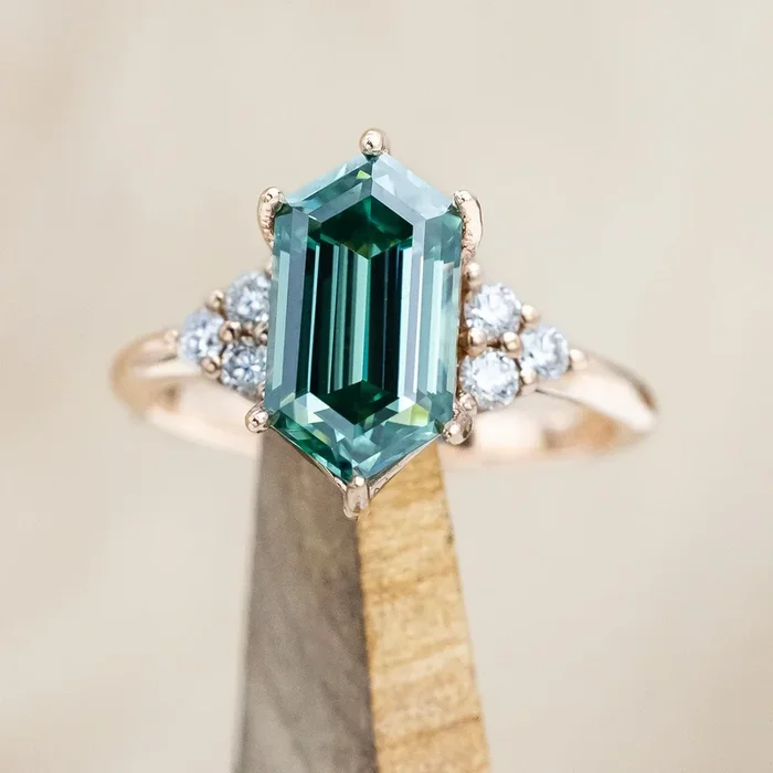 “OCTAVIA” – ELONGATED HEXAGON CUT GREEN MOISSANITE ENGAGEMENT RING WITH DIAMOND ACCENTS – 14K ROSE GOLD – SIZE 4 1/2