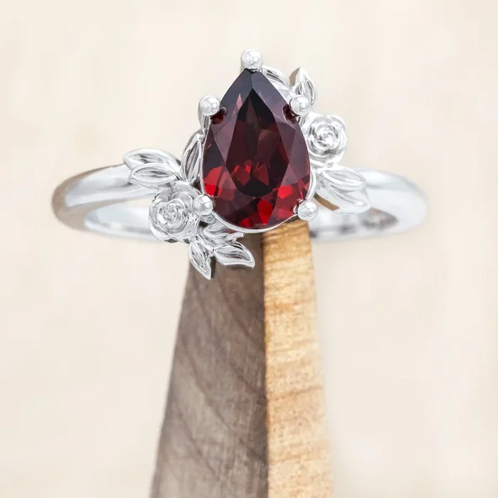 “ROSA” – MOZAMBIQUE GARNET ENGAGEMENT RING WITH FLOWER ACCENTS