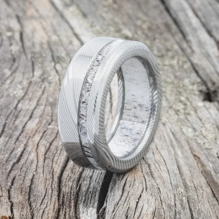 “VERTIGO” – ELK ANTLER WEDDING RING FEATURING AN ELK ANTLER LINED DAMASCUS STEEL BAND