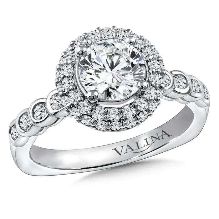 Diamond halo engagement ring mounting with “pillow” shape halo and bezel-set side stones in 14k white gold.