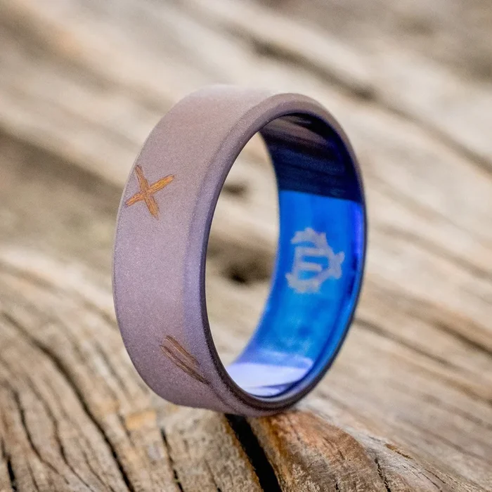 FIRE-TREATED TITANIUM WITH DISTRESSED MARKS & A SANDBLASTED FINISH