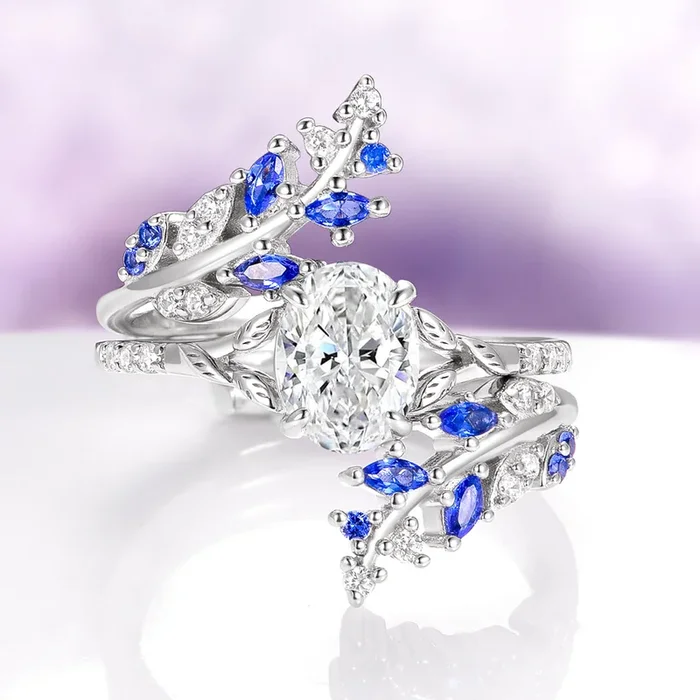 Oval Cut Moissanite & Blue Sapphire Leaf Engagement Ring Set in 14K White Gold