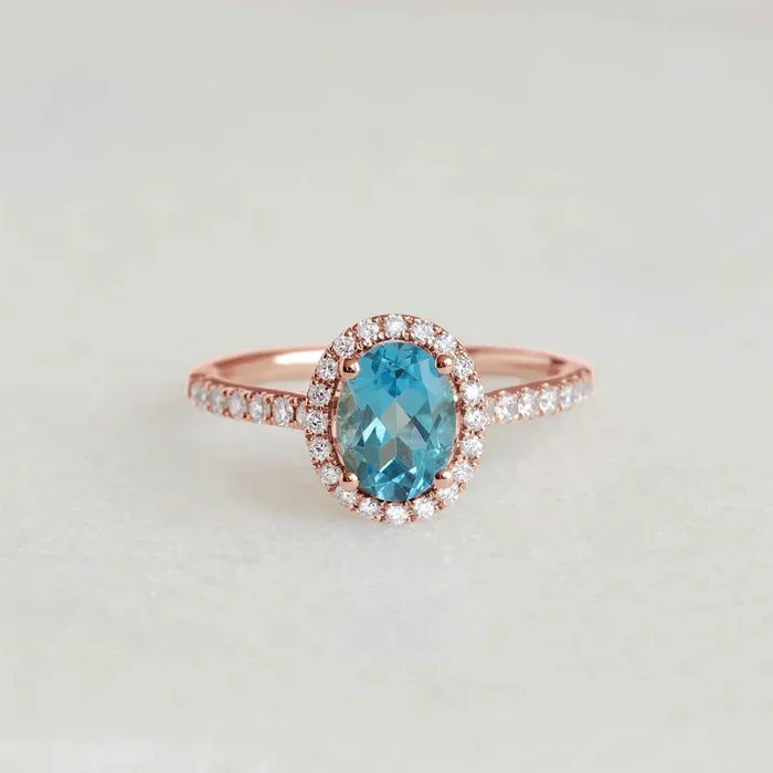 Oval Swiss Blue Topaz Halo Ring Rose Gold – Suna