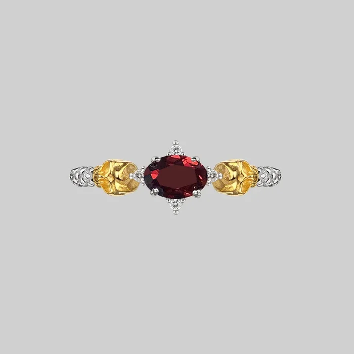 POISON. Garnet & Skulls Ring – Silver