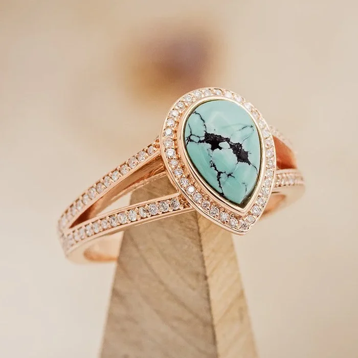 SPLIT SHANK ENGAGEMENT RING WITH DIAMOND ACCENTS AND A PEAR CABOCHON CUT TURQUOISE